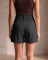 The Monroe short in black — back view on model