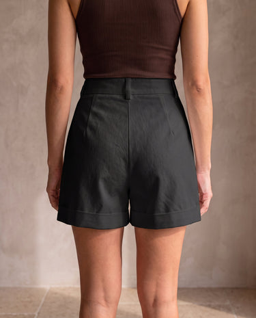 The Monroe short in black — back view on model