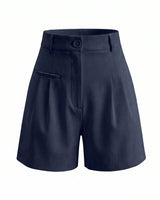 The Monroe short in navy — high-waisted pleated wide-leg shorts, product flat-lay