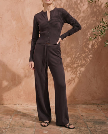 The Moriel Knit Ribbed Matching Set in chocolate — ribbed knit cardigan and wide-leg trousers, front view on model