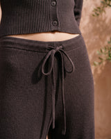 The Moriel Knit Ribbed Matching Set in chocolate — close-up of ribbed knit trouser tie waist detail