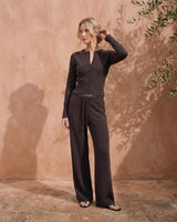 The Moriel Knit Ribbed Matching Set in chocolate — ribbed knit set with wide-leg trousers, side view on model