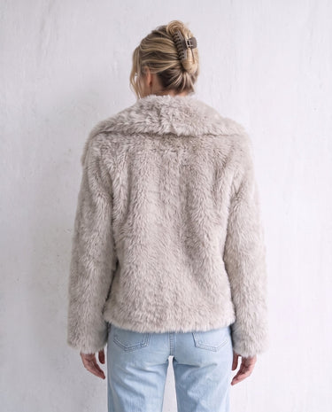 The Noa Faux Fur Coat in beige — faux fur coat, back view on model