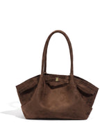 The Odette Suede Tote in brown, front view on a pure white studio background with soft shadow