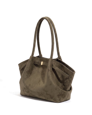 The Odette Suede Tote in dark olive green, three-quarter studio view on a pure white background with gold-tone keeper