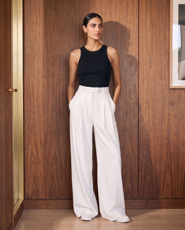 The Oriane pants in white — full-length front view on model