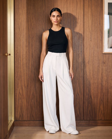 The Oriane pants in white — front view on model