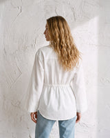 The Palma Cotton Button Up in white — collared cotton shirt, back view on model