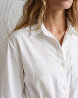 The Palma Cotton Button Up in white — close-up of collar and button placket