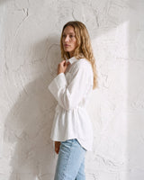 The Palma Cotton Button Up in white — collared cotton shirt, side styling view on model