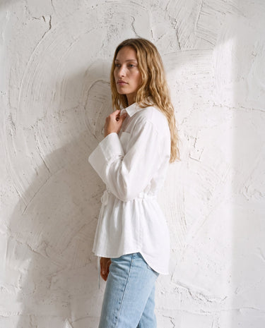 The Palma Cotton Button Up in white — collared cotton shirt, side styling view on model