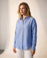 Model wearing the blue poplin shirt with white trousers, front view – Moriel Heritage