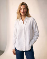 Model wearing the white poplin shirt untucked over jeans – Moriel Heritage