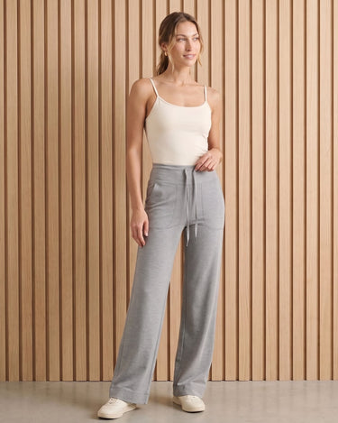 The Rae relaxed pant in light gray — full-length front view on model