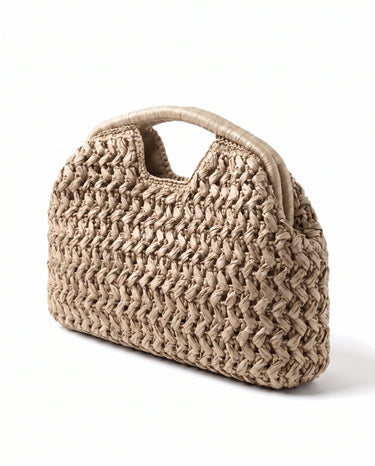 The Ravello Woven Clutch in beige, three-quarter studio view showing the woven body and top handle cut-out