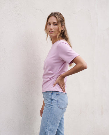 The Riela Tee in pink — short-sleeve tee, side view on model