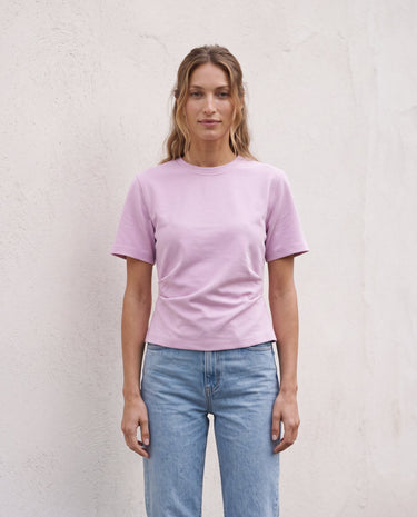 The Riela Tee in pink — short-sleeve tee, front view on model