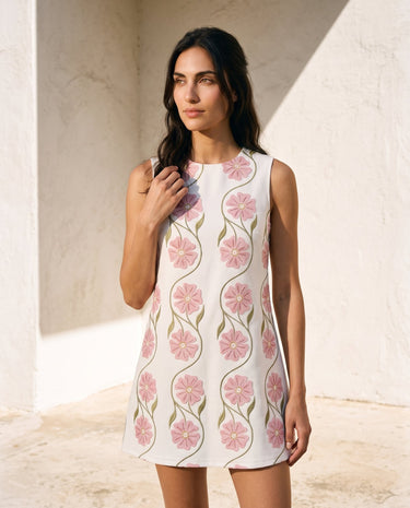 The Rosalie Floral Dress in pink — sleeveless floral mini dress, front view on model