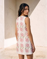 The Rosalie Floral Dress in pink — sleeveless floral mini dress, back view on model