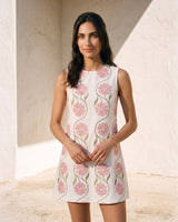 The Rosalie Floral Dress in pink — sleeveless floral mini dress, front view on model