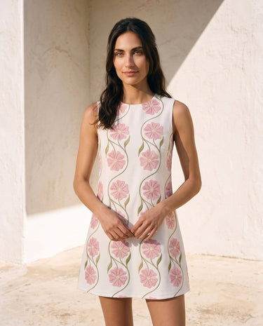 The Rosalie Floral Dress in pink — sleeveless floral mini dress, front view on model