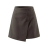 The Rovella Skirt in brown — asymmetric wrap mini skirt with button placket, product flat-lay