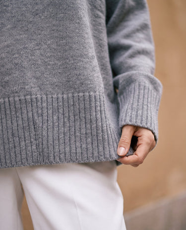 The Ruby sweater in stone — close-up of the ribbed hem and cuff
