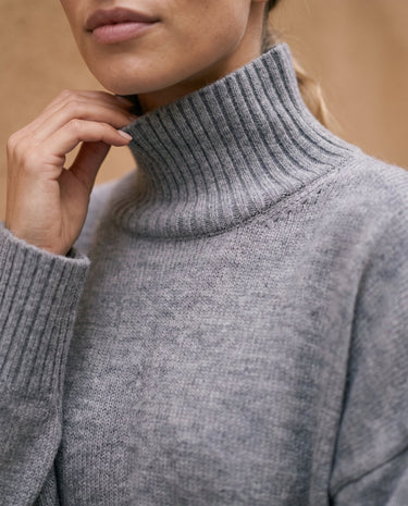 The Ruby sweater in stone — close-up of the turtleneck collar