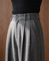The Sabine tailored trousers in gray — close-up of the waistband and front pleats