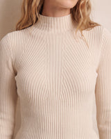 The Sable mock neck top in beige — close-up of the mock neck and ribbed knit