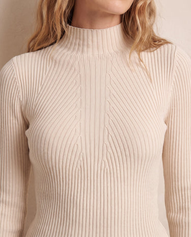 The Sable mock neck top in beige — close-up of the mock neck and ribbed knit