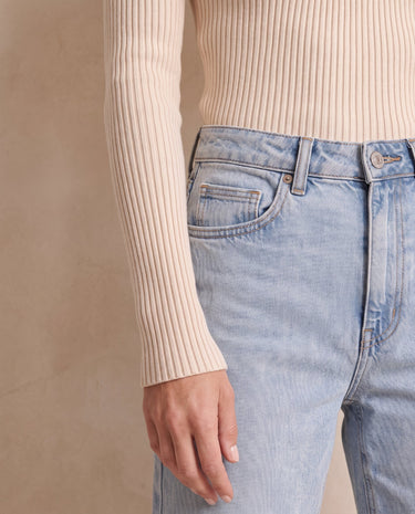 The Sable mock neck top in beige — close-up of the ribbed cuff
