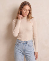 The Sable mock neck top in beige — front view on model