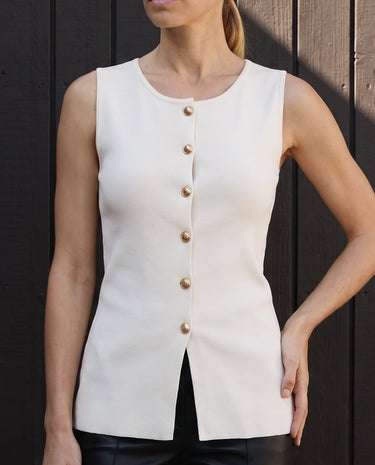 Close front view of the white gold-button vest worn with black trousers – Moriel Heritage