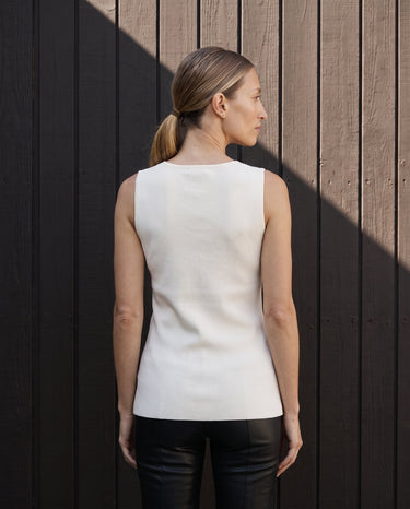 Back view of the white sleeveless vest showing the clean shoulder line – Moriel Heritage