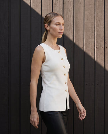 Side view of the white vest showing the longline hem – Moriel Heritage