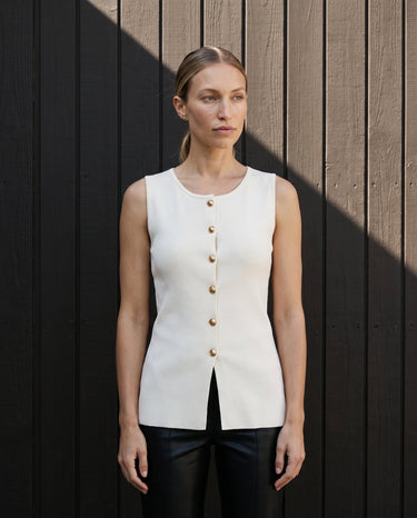Model wearing the white gold-button vest with black trousers, full length – Moriel Heritage