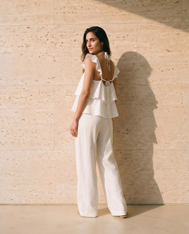 The Seraphine Cotton Set in white — two-piece set showing tie-back neckline, back view on model