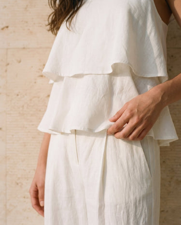 The Seraphine Cotton Set in white — close-up of tiered ruffle top hem detail