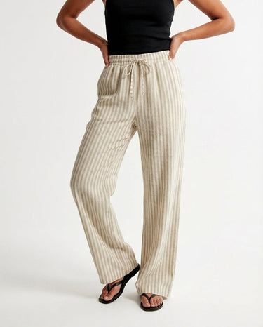 The Seville Stripe Drawstring Pant in brown stripe — striped drawstring trousers, front view on model