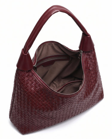 The Siren Woven Bag in burgundy, open top view showing the zip closure and taupe fabric lining
