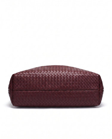 The Siren Woven Bag in burgundy, base view showing the woven underside
