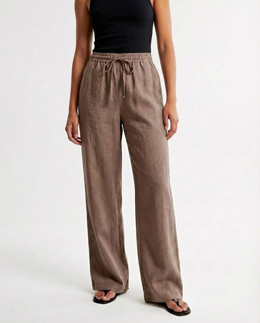The Verena Cotton Linen Trousers in coffee — wide-leg drawstring trousers, front view on model