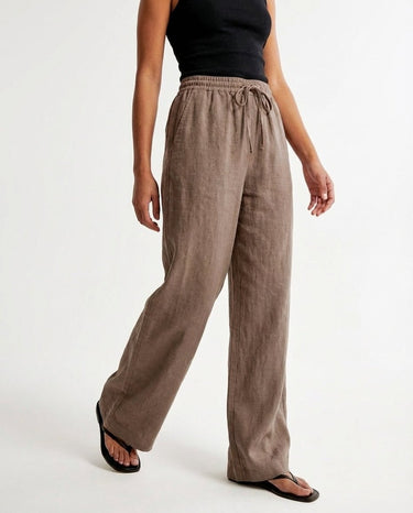 The Verena Cotton Linen Trousers in coffee — wide-leg trousers, side view on model