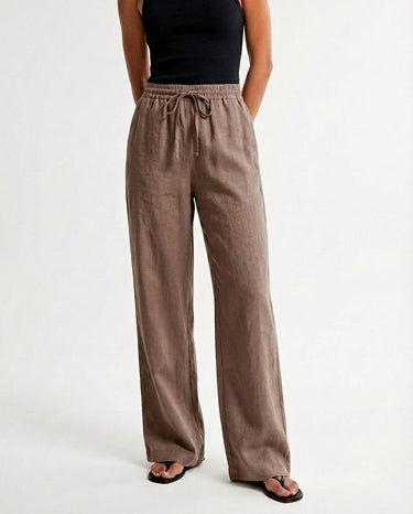 The Verena Cotton Linen Trousers in coffee — wide-leg drawstring trousers, front view on model