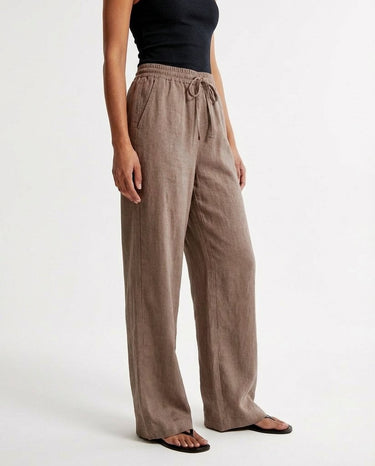The Verena Cotton Linen Trousers in coffee — wide-leg trousers, front view on model