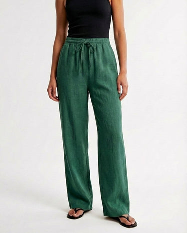 The Verena Cotton Linen Trousers in green — wide-leg drawstring trousers, front view on model