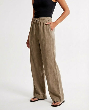 The Verena Cotton Linen Trousers in khaki — wide-leg drawstring trousers, front view on model