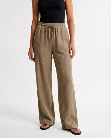 The Verena Cotton Linen Trousers in khaki — wide-leg trousers, front view on model