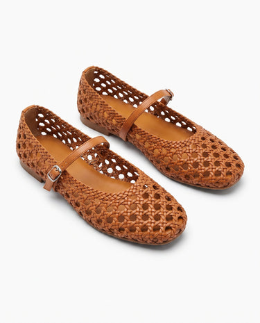 The Wren Mary Janes in camel — woven square-toe flats with buckle strap, angled pair view